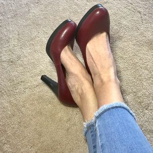 Red round toe platform pumps by Candies